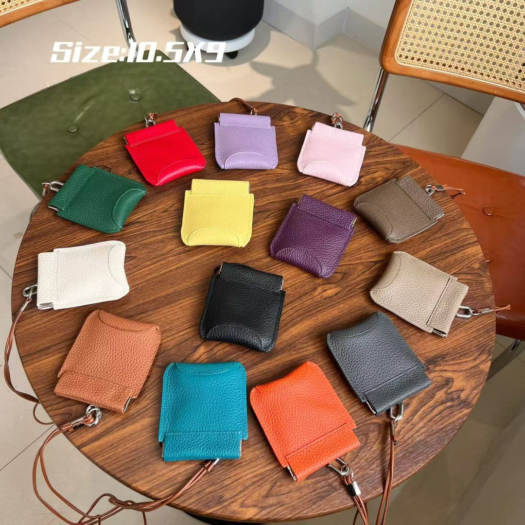 The first layer of cowhide neck red envelope earphone bag is versatile, exquisite clip, storage change bag, Korean version mini card bag.
