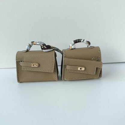 Mini double-sided irregular bag pendant bluetooth headset protective case new creative car pendant