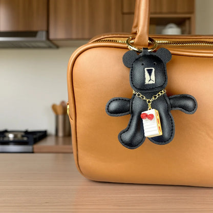 Adorable Lazy PU Leather Bear Keychain with Strawberry Cake Pendant. Cute and Funny Purse Charm- Perfect Relaxing Accessory
