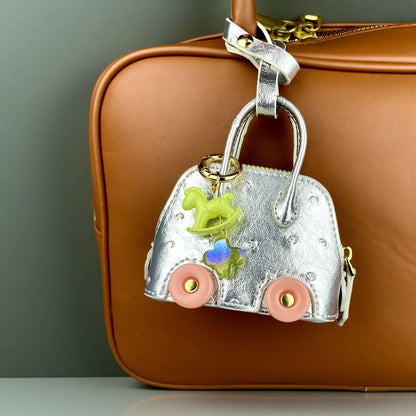 Mini Handbag Purse with Wheels&Rocking Horse-Cute Ostrich Pattern PU Leather Case for AirPods, Coin, Cable, Keychain Bag Charm